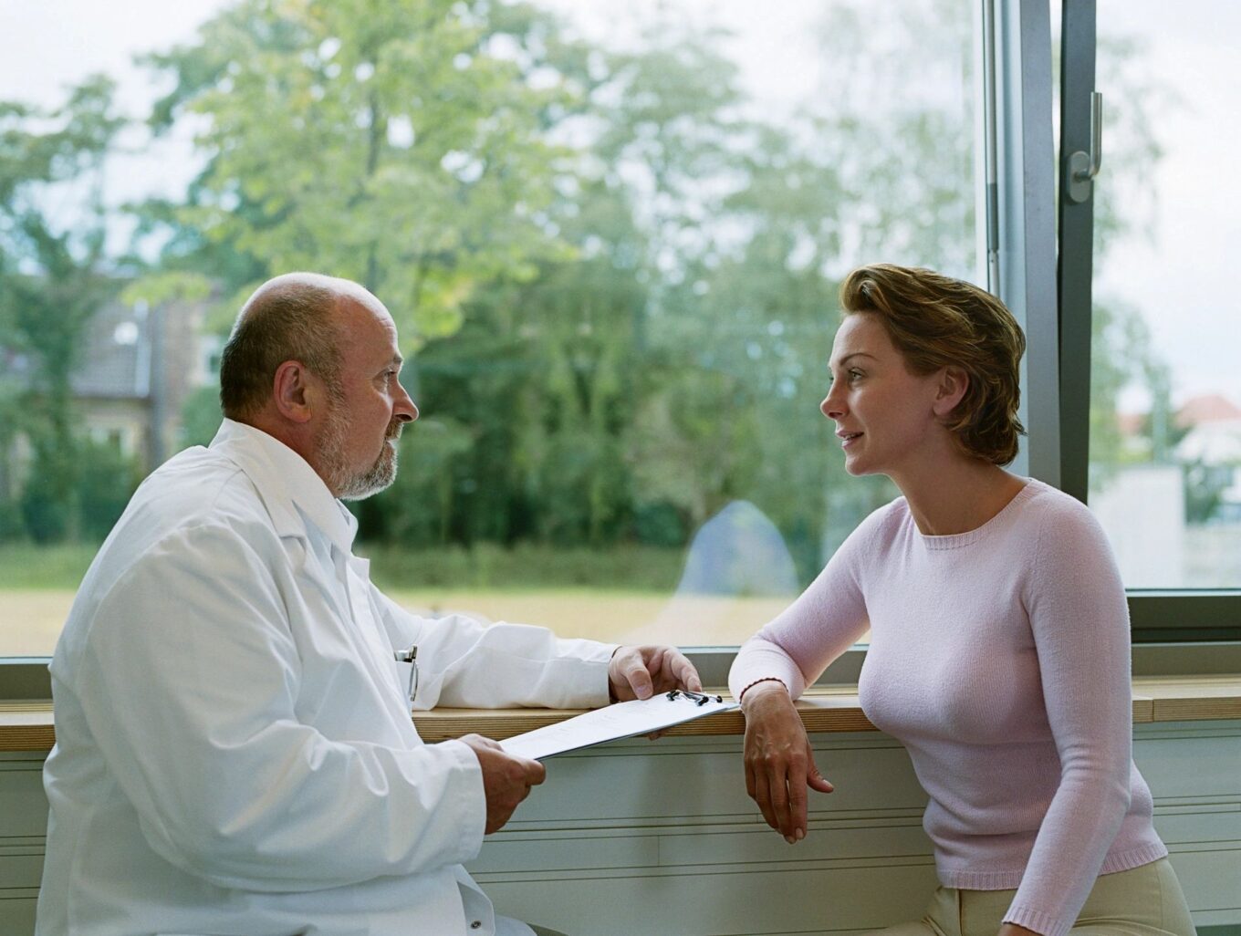 Woman Discussing Hormone Replacement Therapy with her Doctor